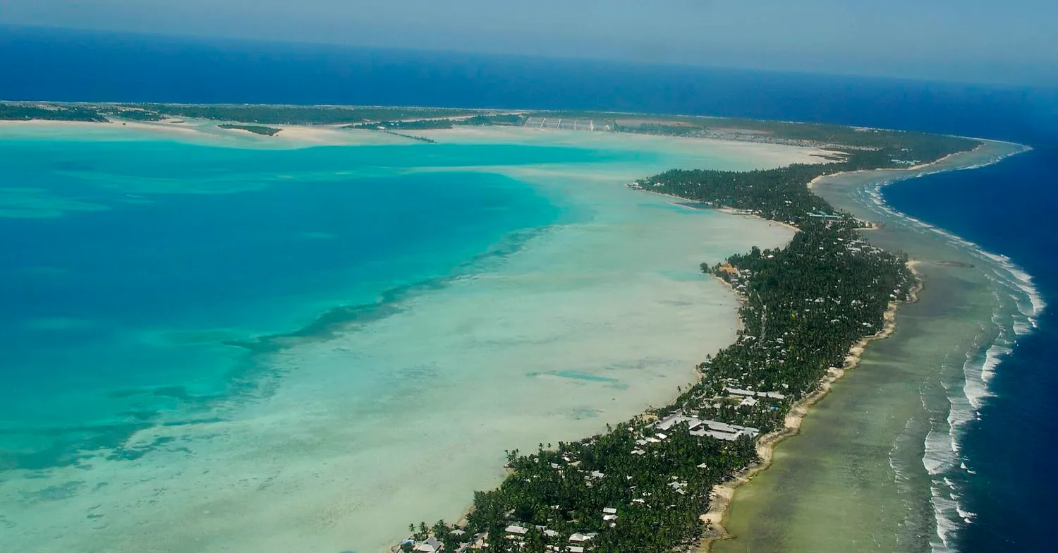 South Tarawa from the air, the narrow strip of land between the lagoon and the open ocean.